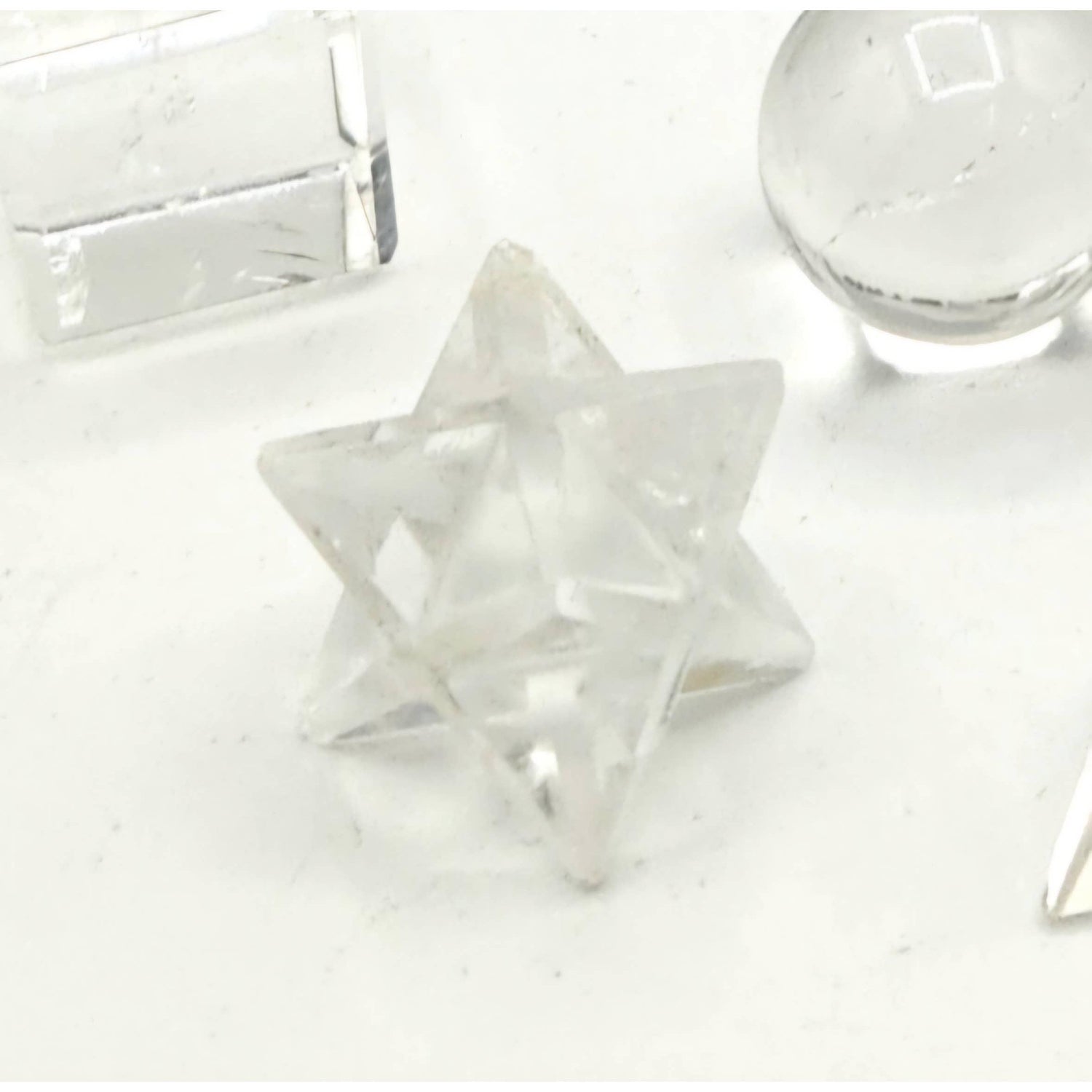 Clear Quartz Sacred Geometry Set – 7 Carved Crystals + Merkaba &amp; Sphere with Grid &amp; Pouch