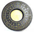 Circular metal tealight candle holder with 12 zodiac signs in gold relief on black finish for astrological altar décor