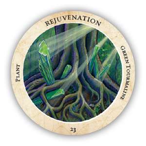 Crystal Medicine Oracle circular card featuring a green tourmaline crystal illustration with energetic healing light emanating from the stone.