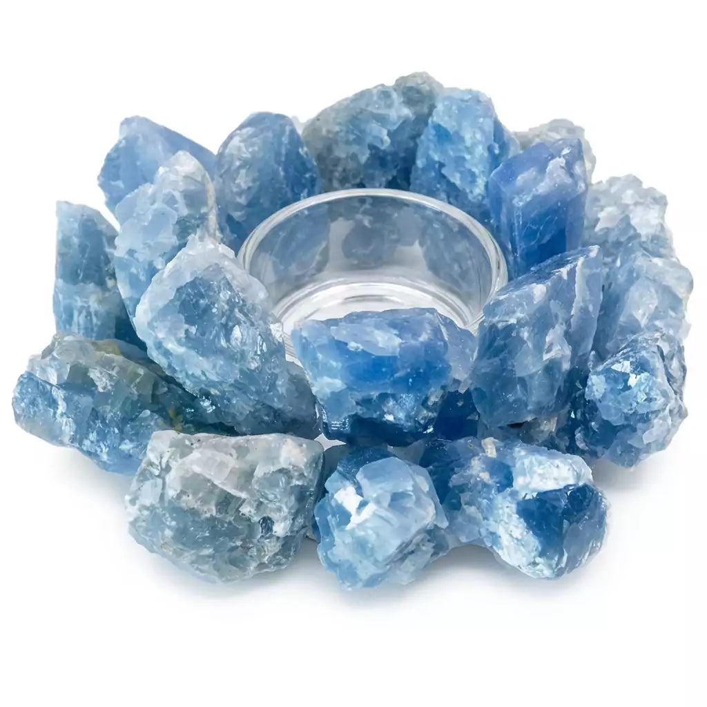 A 4.5-inch carved blue calcite tealight candle holder showing pale sky-blue coloring with natural white veining and a circular hollowed center for the tealight