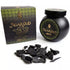 Black jar of Sonavi Agar Oud bakhoor incense chips next to its decorative box, with small dark agarwood chips scattered about — 40g natural agarwood resin blend.
