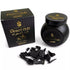 Jar of Sonavi Desert Oud bakhoor incense chips next to its decorative box, with small oud wood pieces scattered around — 40g natural agarwood blend inspired by desert nights.