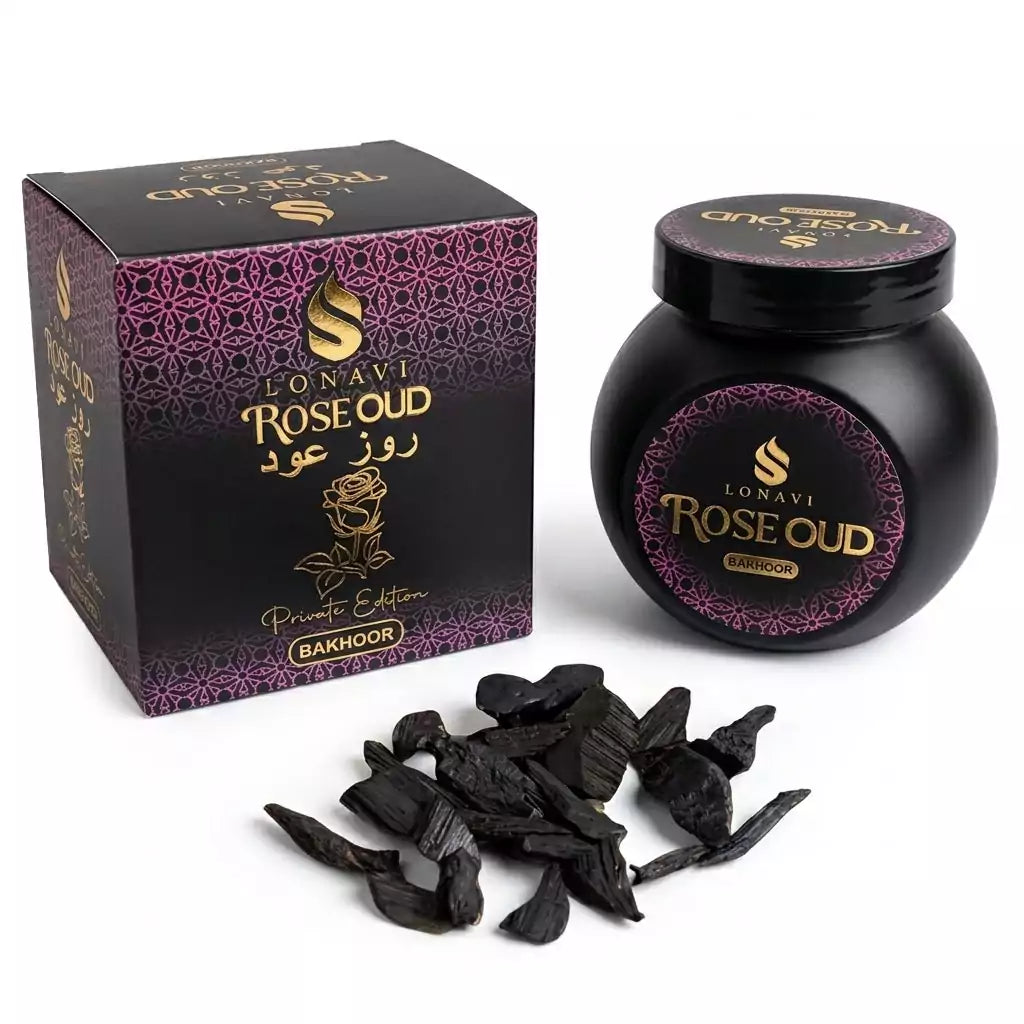 Black jar labeled Rose Oud next to its decorative box, with small oud wood pieces — Sonavi 40g rose and agarwood bakhoor chips for love ritual.