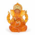 Translucent orange resin Ganesha statue 5 inches tall with gold accent detailing, depicting the elephant-headed Hindu deity Remover of Obstacles for altar and devotional use.