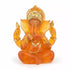 Translucent orange resin Ganesha statue 5 inches tall with gold accent detailing, depicting the elephant-headed Hindu deity Remover of Obstacles for altar and devotional use.