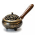 9-inch metal incense burner with antiqued golden finish, intricate swirling pattern on the decorative metal top, and wooden handle — compact charcoal and resin censer for ritual space clearing and altar use.