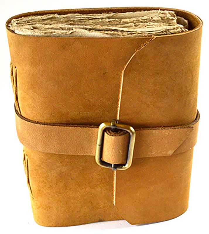 Worn tan leather journal with aged paper pages secured by a vintage buckle strap, 4.5x6.5 inches for ritual journaling and grimoire use.