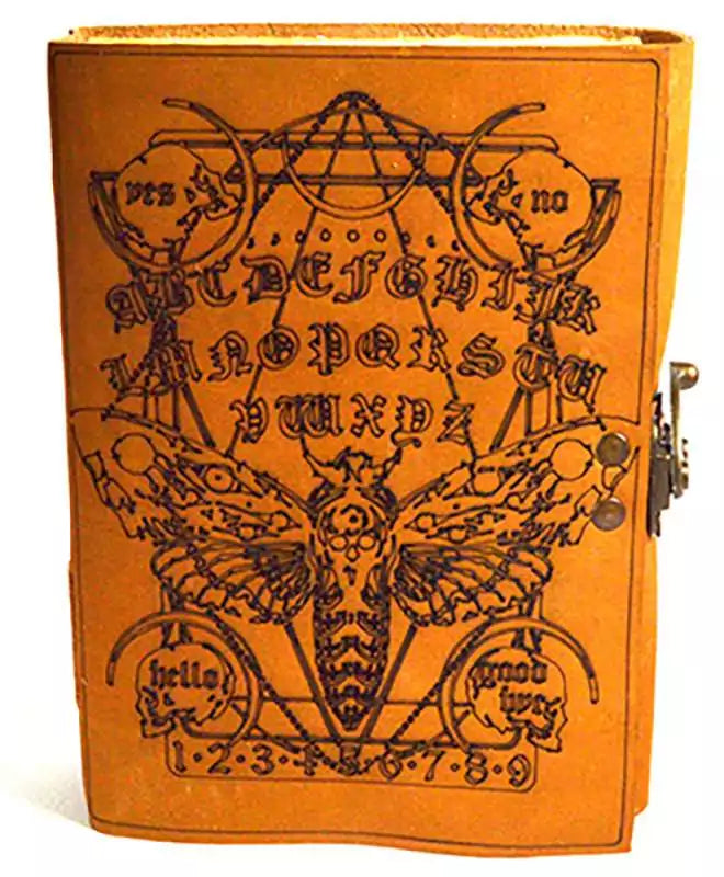 Leather-look journal with intricate moth and Ouija board geometric design on aged leather cover, secured with a metal clasp latch, for occult and shadow work journaling.