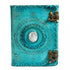 Turquoise blue leather-bound journal with embossed decorative design and embedded stone accent with metal latch closure