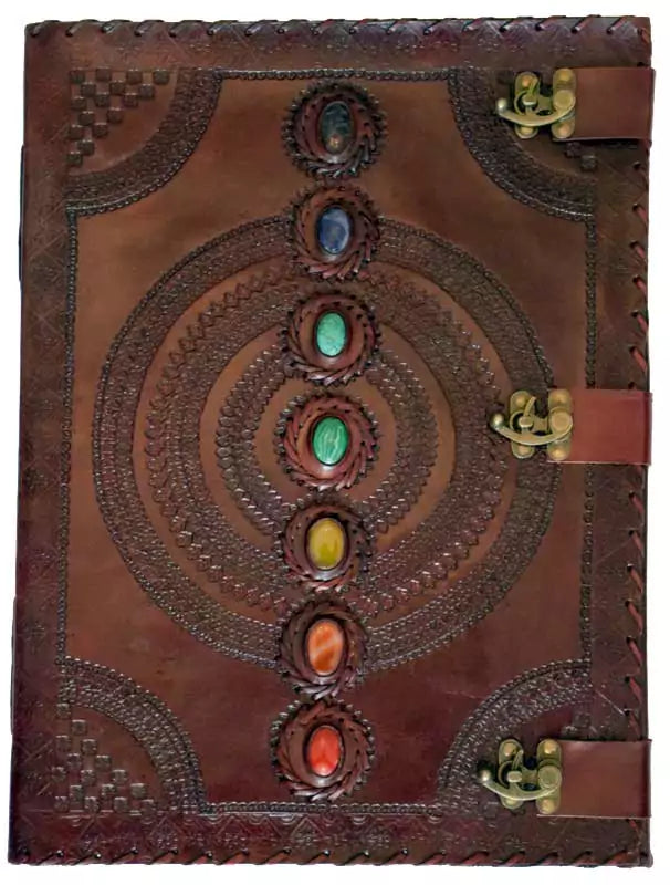 7 stone leather blank book with triple metal latch closure showing seven chakra gemstones embedded in leather cover, ritual journal for grimoires and Book of Shadows