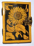 Leather-bound blank journal with embossed sunflower design on the cover and a decorative latch closure, suitable for use as a grimoire or spell journal.