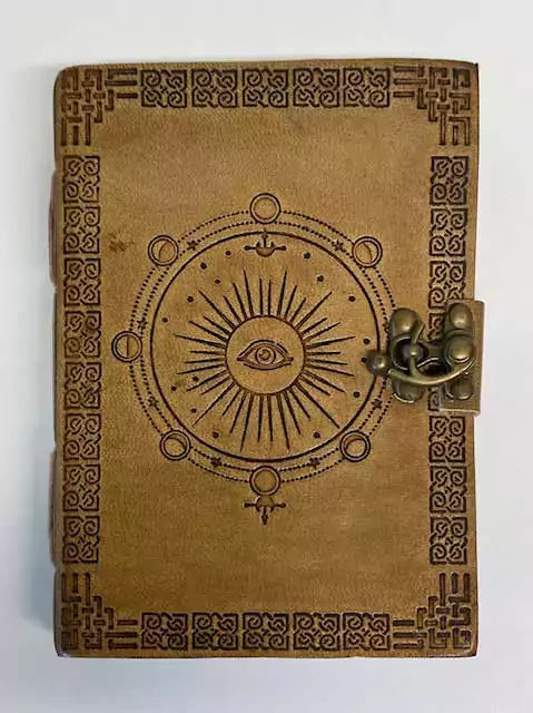 5 by 7 inch moon phase embossed leather journal with latch closure for lunar cycle tracking and ritual notes