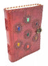 6x8 inch handcrafted embossed leather journal with seven real gemstone chakra stones embedded in the cover and a metal latch — for chakra practice and spiritual writing.