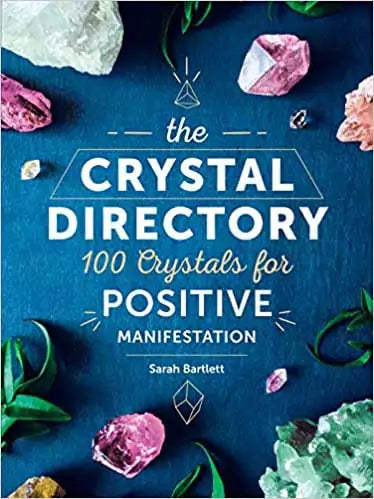 Hardcover Crystal Directory book by Sarah Bartlett with a vibrant illustrated cover showing 100 Crystals for Positive Manifestation as subtitle.