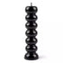 Black seven-knob banishing ritual candle with seven sections for burning one per day to progressively remove obstacles and clear blockages over a week