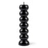 Black seven-knob banishing ritual candle with seven sections for burning one per day to progressively remove obstacles and clear blockages over a week