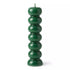 Green seven knob candles for abundance rituals showing seven-segment green wax candle form for weekly intention-setting workings