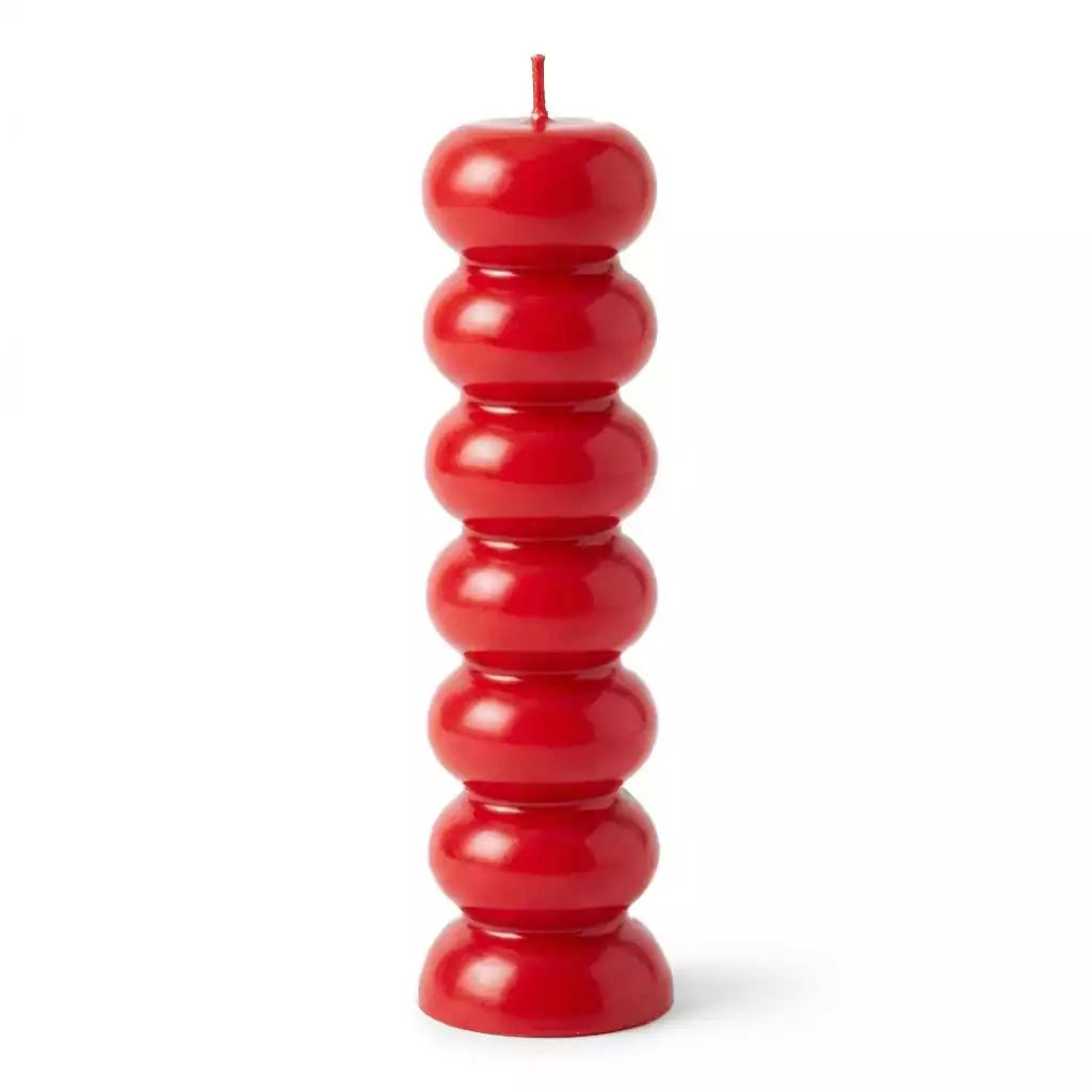 Red seven knob candle — tall stacked spherical red wax candle with seven rounded sections for seven-day love and passion spell work.
