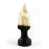 10-inch Santa Muerte figure candle with white wax at the top transitioning to black at the base, shaped as a robed Holy Death figure with a wick at the crown.