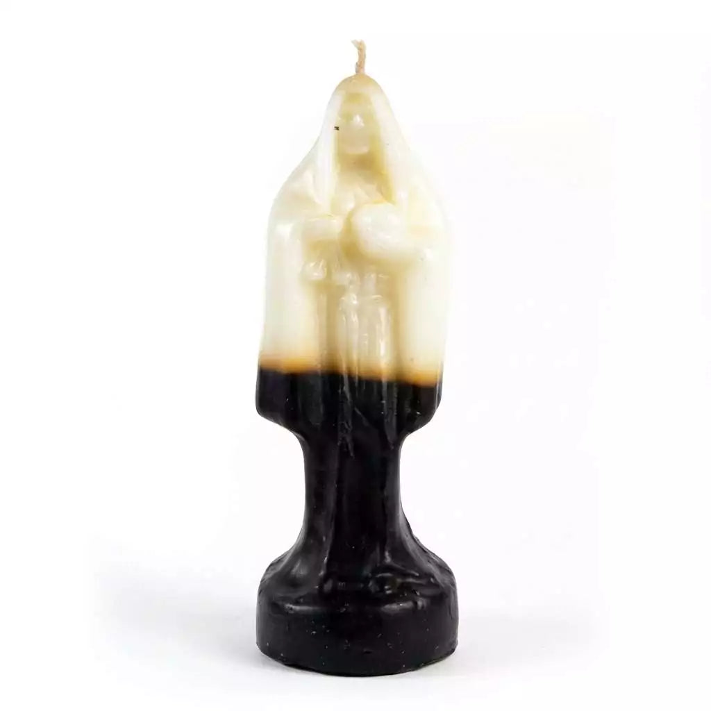 10-inch Santa Muerte figure candle with white wax at the top transitioning to black at the base, shaped as a robed Holy Death figure with a wick at the crown.