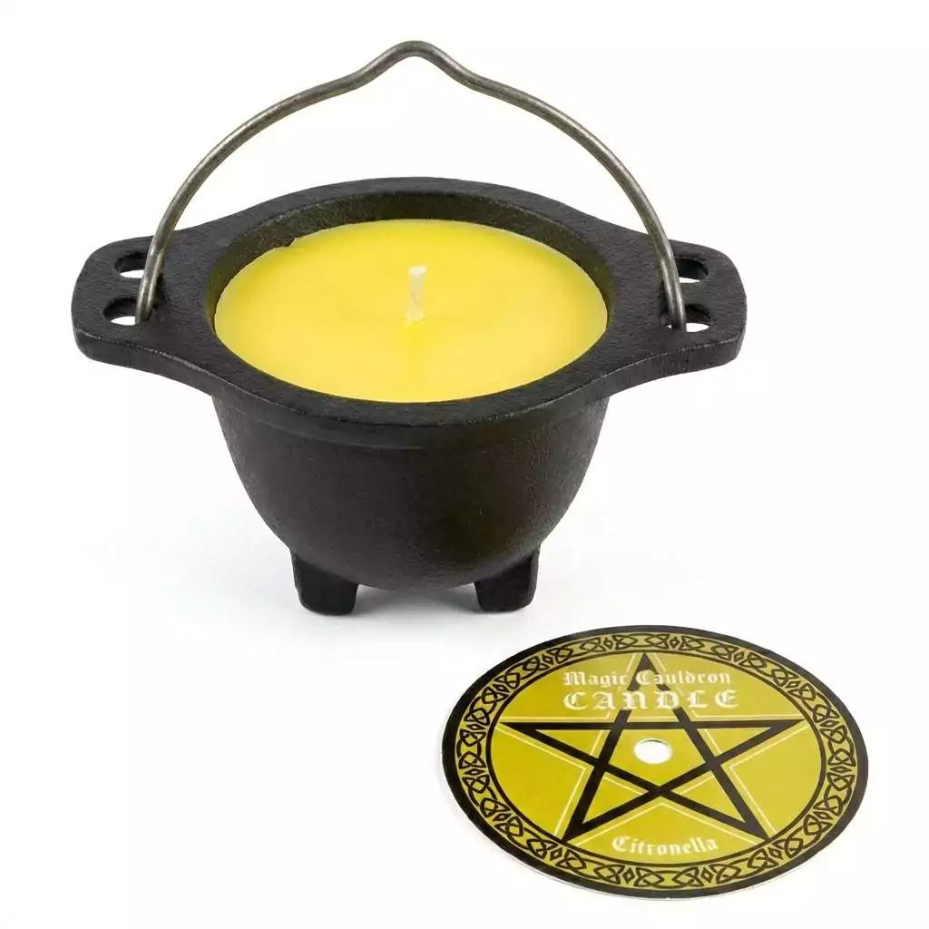 Small black cast iron cauldron with a yellow citronella candle inside and a circular holder stand, designed for outdoor ritual use and insect repelling patio altars.
