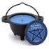 Small black cast iron cauldron filled with blue nag champa wax, pentagram label on the front, for ritual candle burning and meditation ambiance.