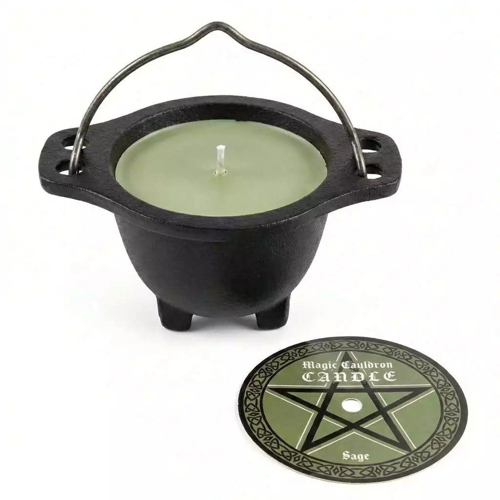 Small black cast iron cauldron containing a green sage-scented wax candle for altar cleansing and ritual decoration
