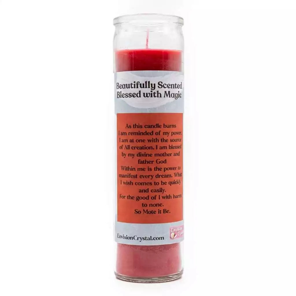 Red scented candle in clear glass container with Magical Manifestation label burning in atmospheric candlelit setting