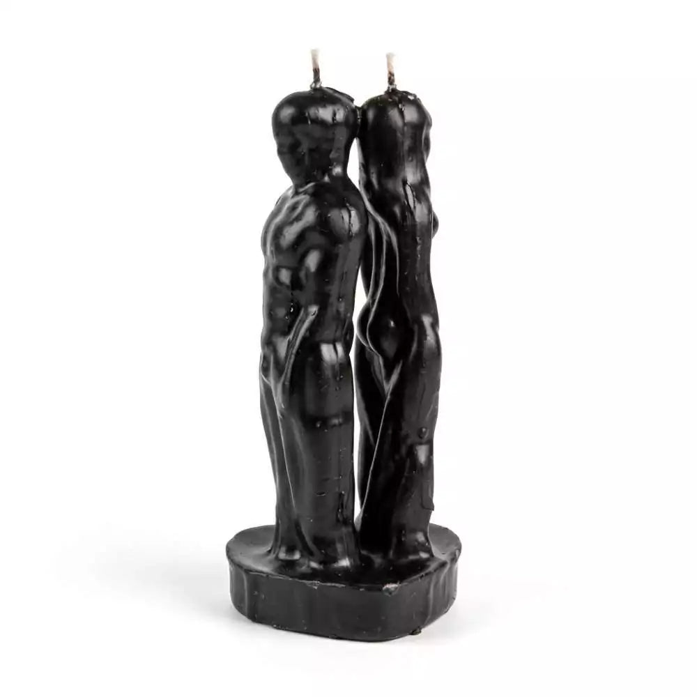 Black dual-figure separation candle showing man and woman forms back to back on a shared base — 6.5-inch hoodoo cord-cutting ritual candle.