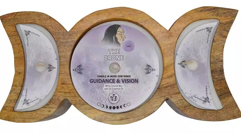 Crone Guidance and Vision triple moon candle on carved circular wooden display disc — decorative 60-hour ritual altar candle labeled with Guidance &amp; Vision for crone goddess work.