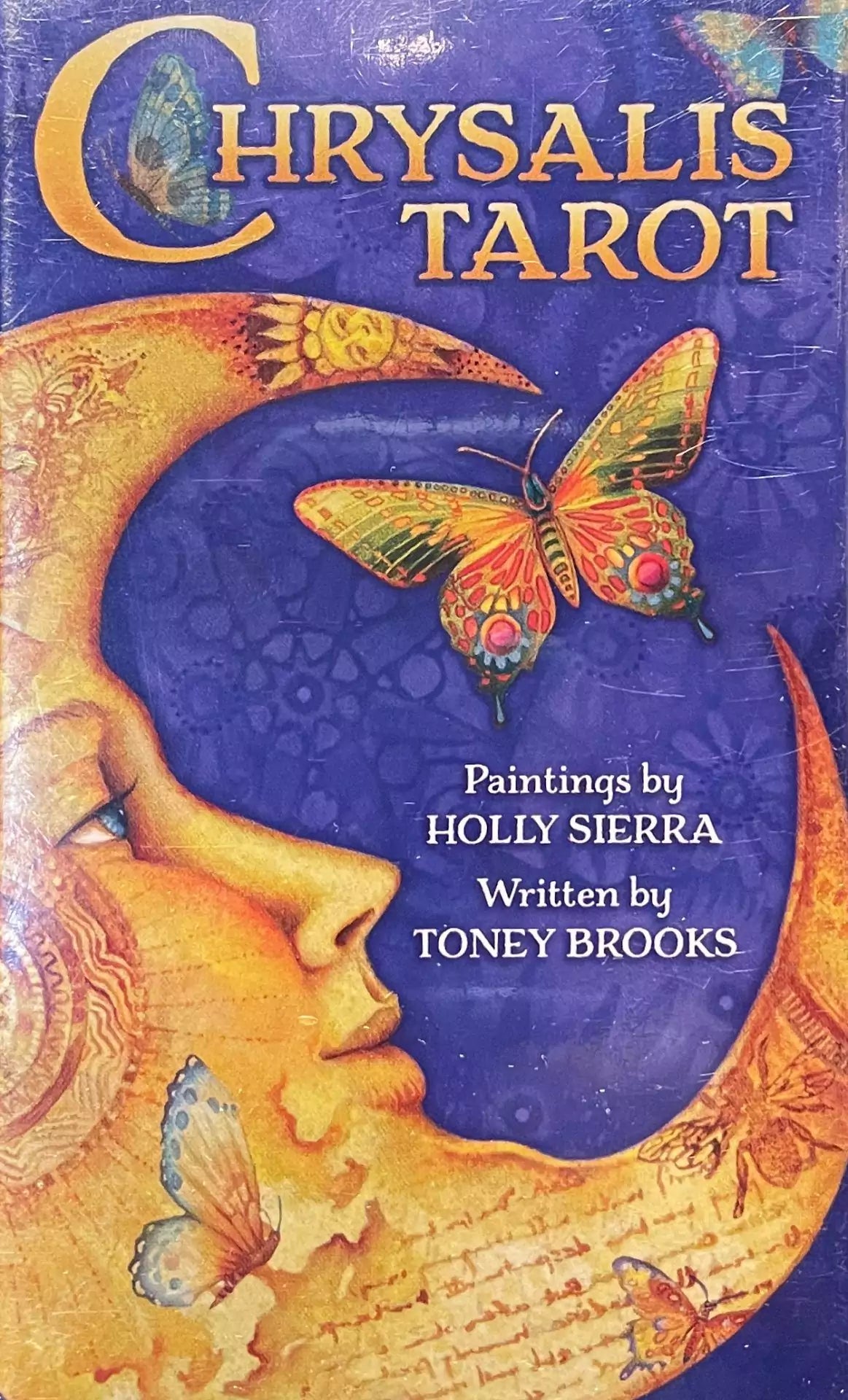 Chrysalis Tarot deck box featuring a crescent moon, butterfly, and colorful mythological artwork by Holly Sierra.