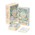 Color Your Own Tarot deck set displayed with decorative box, guidebook, and a visible stack of floral-patterned tarot cards.
