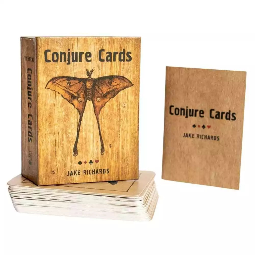 Wooden box for Conjure Cards by Jake Richards featuring a moth illustration on the lid and a small deck of illustrated cards beside it.