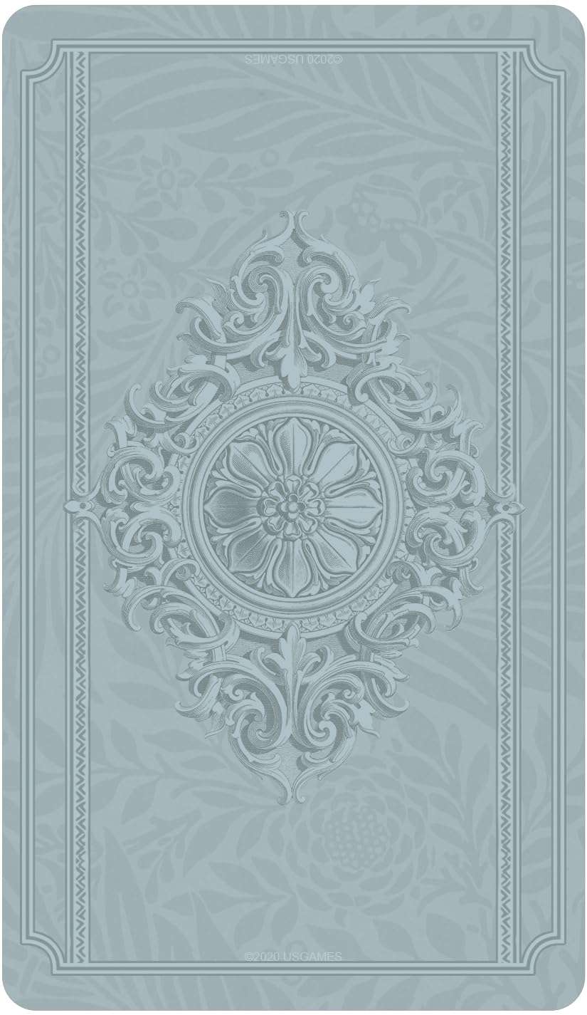 Textured embossed card back design in light blue with central floral motif from the Dreamkeepers Tarot deck.