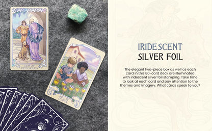 Two Ethereal Visions Tarot cards displayed on a textured surface beside a green crystal and a fanned-out deck.