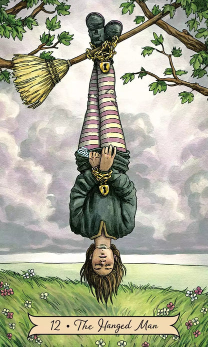 Person hanging upside down from a tree branch in a colorful outfit — the Hanged Man card from the Everyday Witch Tarot deck.