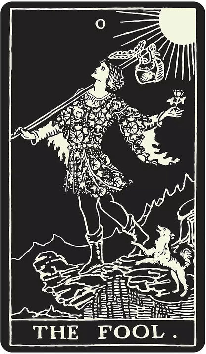 Glow-in-the-dark Tarot card showing The Fool — a figure on a cliff holding a flower, with a dog beside them, in glowing lines on black.