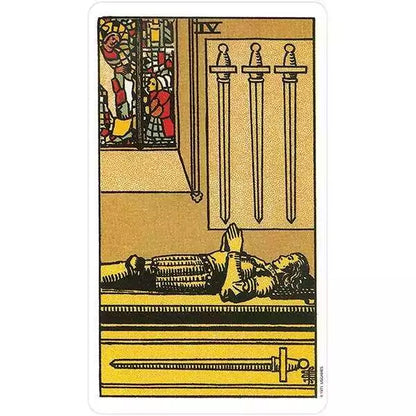 Rider-Waite Tarot 4 of Swords card — knight lying on a stone slab with clasped hands, three swords on the wall, from the Restored Edition.