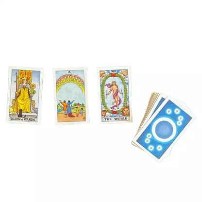 Three Rider-Waite-Smith cards fanned out beside the Tiny Universal Waite deck for scale.