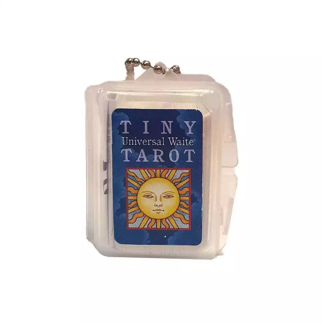 Tiny Universal Waite Tarot keychain clamshell case with a sun-illustrated cover and attached ball chain.