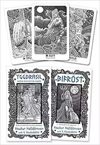 Collection of Yggdrasil Norse Divination Cards showing deities and symbols — intricate pen-and-ink illustrations of Yggdrasil, Bifröst, and Norse mythological figures.