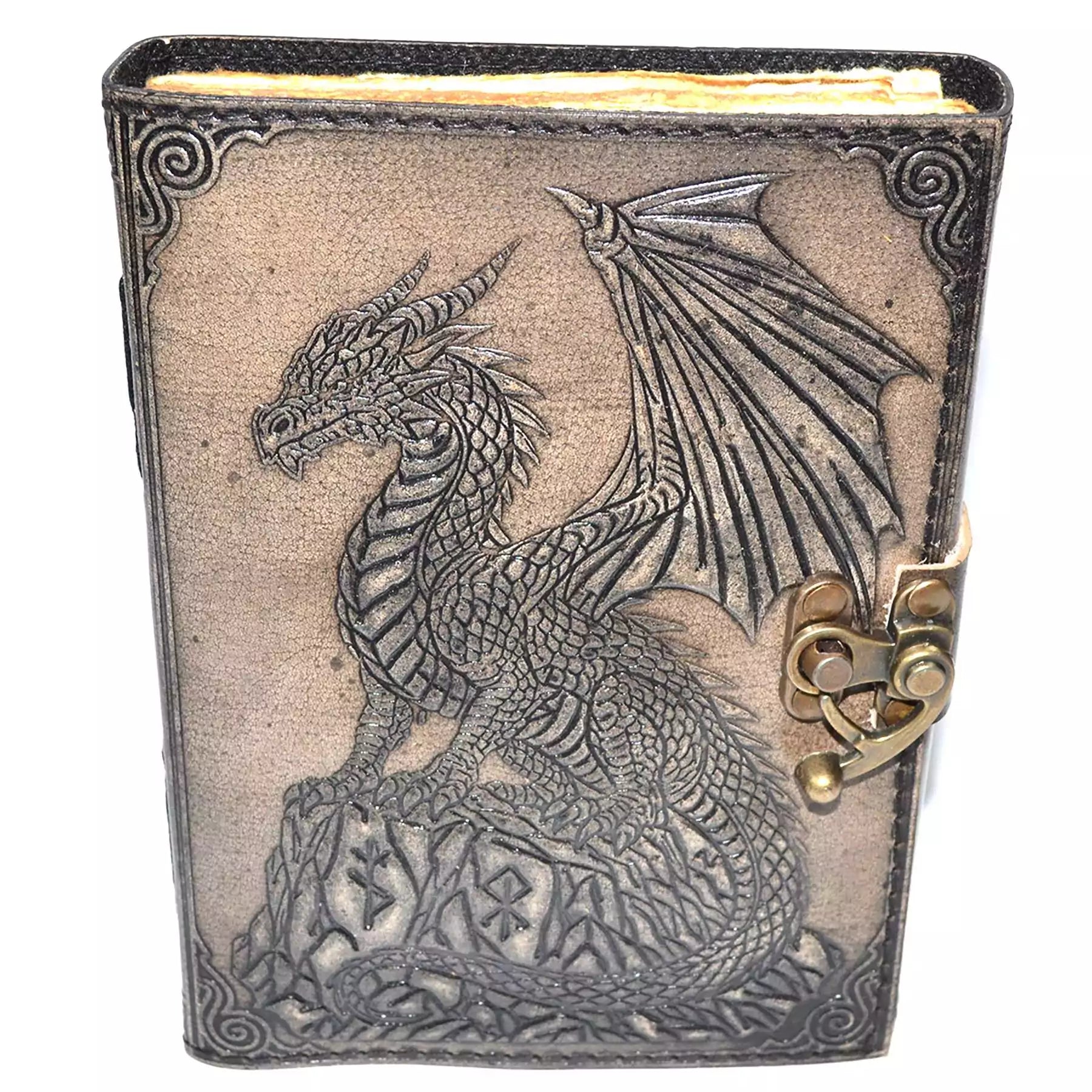 Faux leather journal with latch featuring embossed dragon perched on a rocky outcrop, textured dark cover with aged paper interior pages for grimoire and spell journaling.