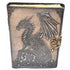 Faux leather journal with latch featuring embossed dragon perched on a rocky outcrop, textured dark cover with aged paper interior pages for grimoire and spell journaling.