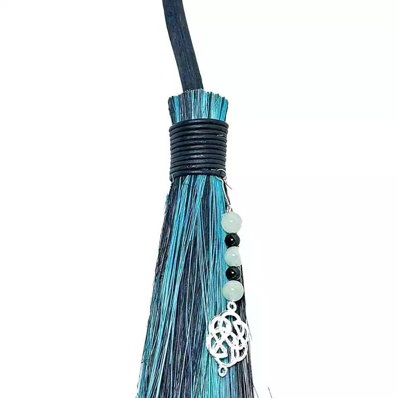 Side view of Celtic black and green besom broom showing traditional broom construction and colors