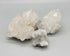 One pound bulk lot of spirit quartz specimens showing central crystal shafts covered in tiny secondary druzy points, the characteristic cactus quartz formation.