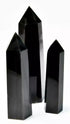 One pound bulk lot of silver sheen black obsidian obelisk towers ranging 3 to 4 inches, showing jet-black volcanic glass with internal silver metallic sheen flash.