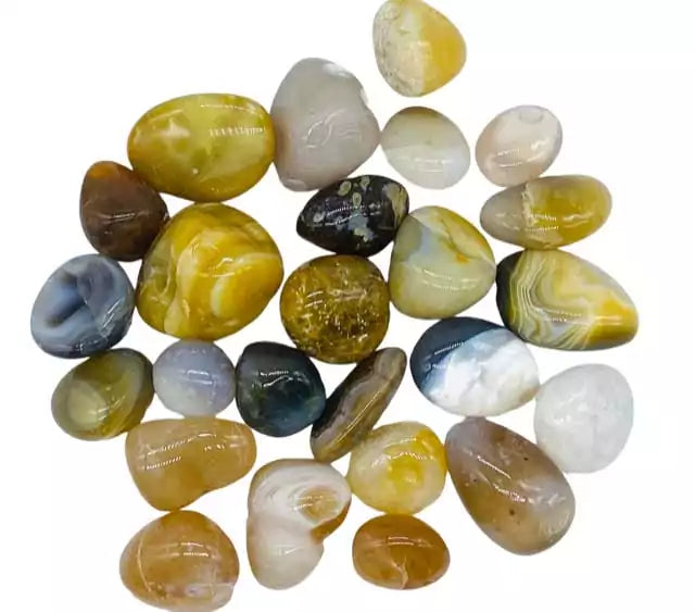 One pound of natural agate polished tumbled stones in assorted earthy tones, for grounding crystal grids, altar display, and bulk crystal apothecary supply.