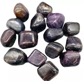 A collection of corundum tumbled stones in grey and brown metallic tones, shown in a 1 lb bulk lot for crystal grids and altar work.