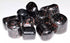 A pile of polished garnet in biotite tumbled stones showing deep red garnet crystals embedded in dark glittering mica matrix, sold in 1 lb bulk.