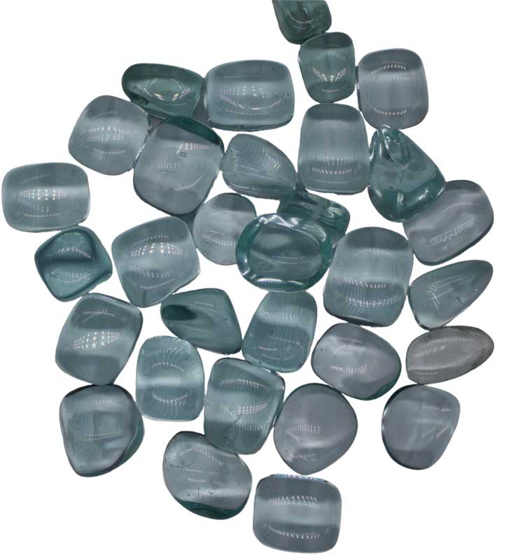 Blue obsidian tumbled stones 1 lb — smooth polished blue obsidian pieces in a pile for throat chakra, communication, and protective crystal work.